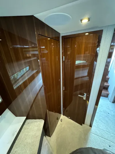  Yacht Photos Pics Interior of 2023 Cruisers Yachts 46 Cantius with sleek wood paneling and modern design.