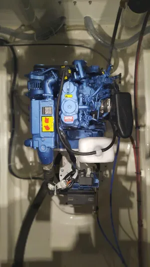  Yacht Photos Pics 2024 Comuzzi Yachts C-32 Sport engine compartment, showcasing a blue marine engine.
