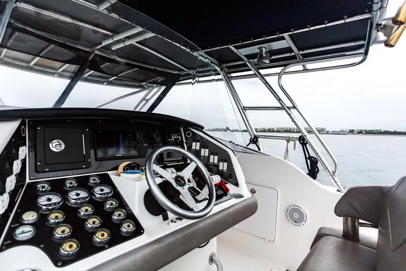 Pressin Paws Yacht Photos Pics 2008 Fountain - Helm