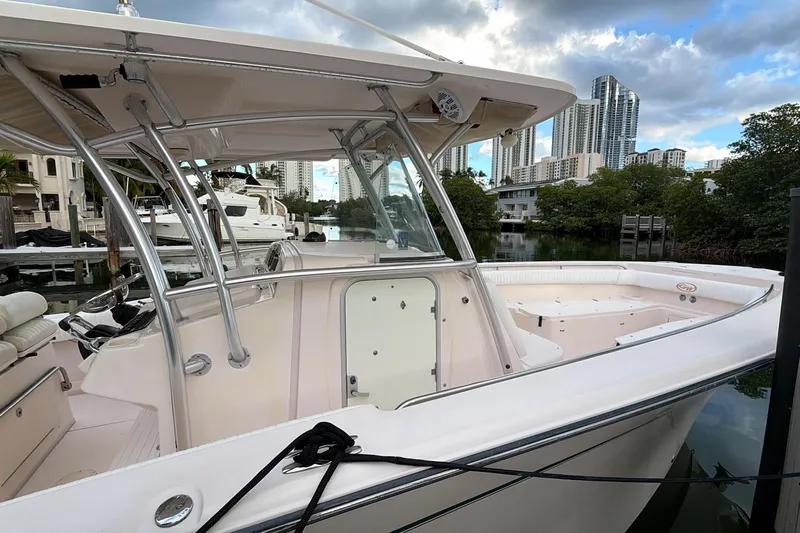  Yacht Photos Pics 2010 Grady-White Canyon 336 boat docked near urban skyline.