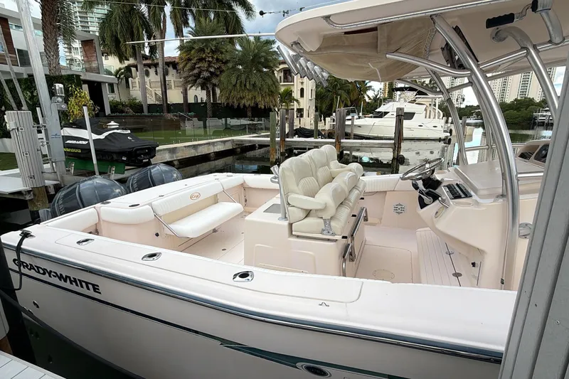  Yacht Photos Pics 2010 Grady-White Canyon 336 boat docked, featuring spacious seating and modern design.