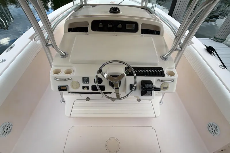 Yacht Photos Pics 2010 Grady-White Canyon 336 boat helm with steering wheel and control panel.