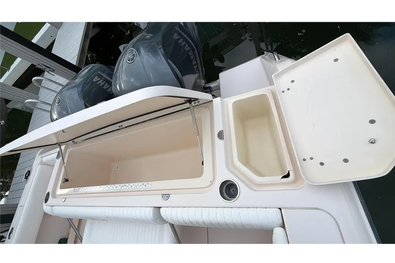  Yacht Photos Pics 2010 Grady-White Canyon 336 boat with open storage compartments and Yamaha engines.