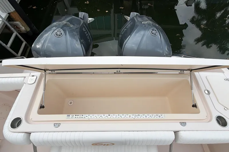  Yacht Photos Pics 2010 Grady-White Canyon 336 boat with open storage compartment and dual Yamaha engines.