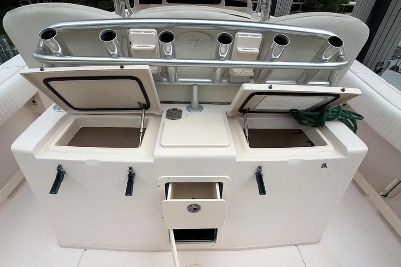  Yacht Photos Pics 2010 Grady-White Canyon 336 boat with open storage compartments and rod holders.