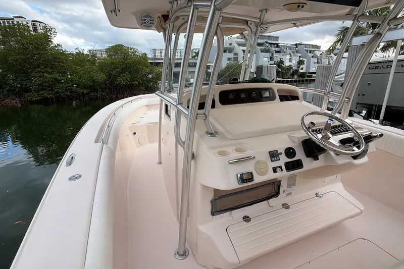  Yacht Photos Pics 2010 Grady-White Canyon 336 boat interior with steering console and seating area.