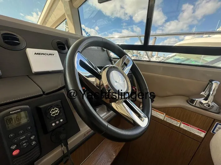  Yacht Photos Pics 2017 Sea Ray Sundancer helm with Mercury controls and modern steering wheel.