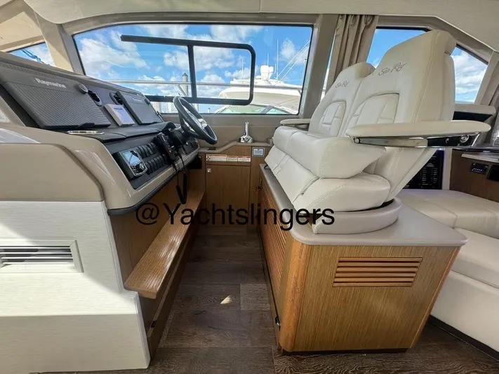  Yacht Photos Pics Interior of 2017 Sea Ray Sundancer yacht with luxurious seating and modern dashboard.