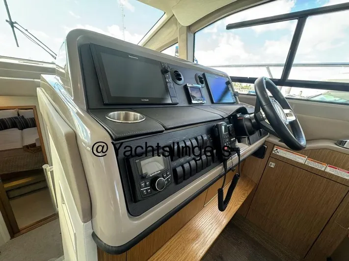  Yacht Photos Pics 2017 Sea Ray Sundancer helm with modern navigation equipment and steering wheel.