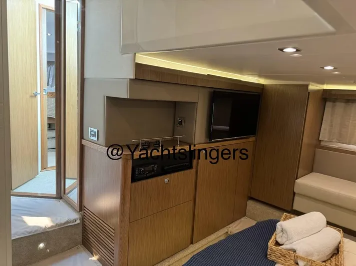  Yacht Photos Pics Interior of 2017 Sea Ray Sundancer yacht with modern wood finishes and cozy seating area.