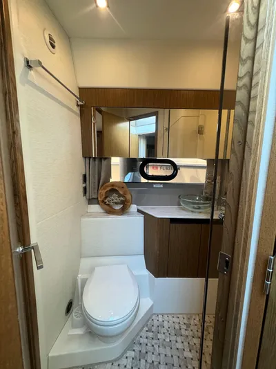  Yacht Photos Pics Luxurious 2017 Sea Ray Sundancer bathroom with modern fixtures and elegant wood accents.