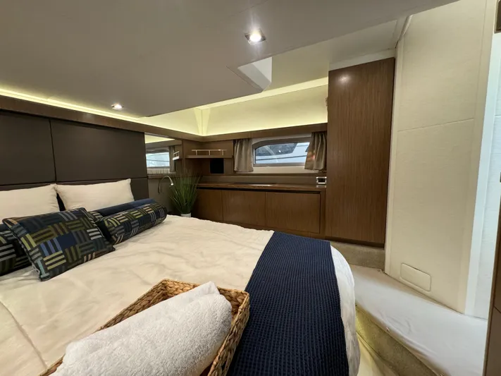  Yacht Photos Pics Luxurious 2017 Sea Ray Sundancer cabin interior with elegant bedding and modern wood finishes.