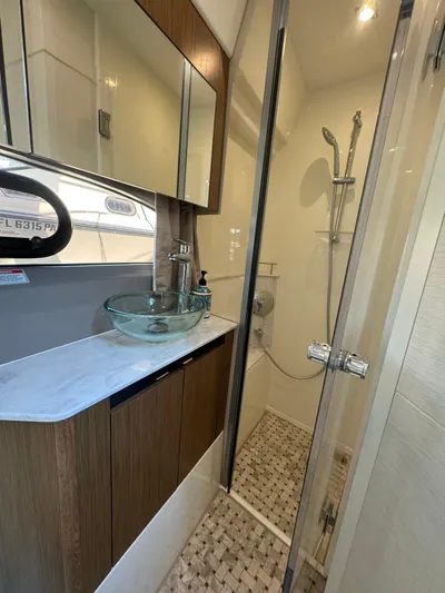  Yacht Photos Pics Luxurious bathroom in 2017 Sea Ray Sundancer yacht with glass sink and modern shower.