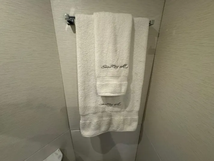 Yacht Photos Pics White towels with "Sea Ray" embroidery hanging in a 2017 Sundancer yacht bathroom.