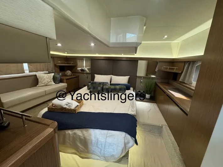  Yacht Photos Pics Luxurious interior of 2017 Sea Ray Sundancer yacht with cozy bed and elegant decor.