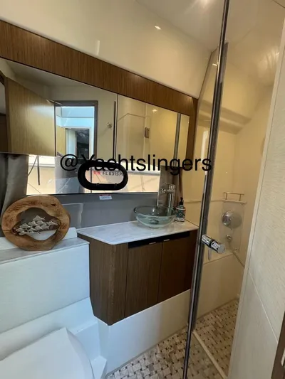  Yacht Photos Pics Luxurious bathroom in 2017 Sea Ray Sundancer yacht with modern fixtures and elegant design.