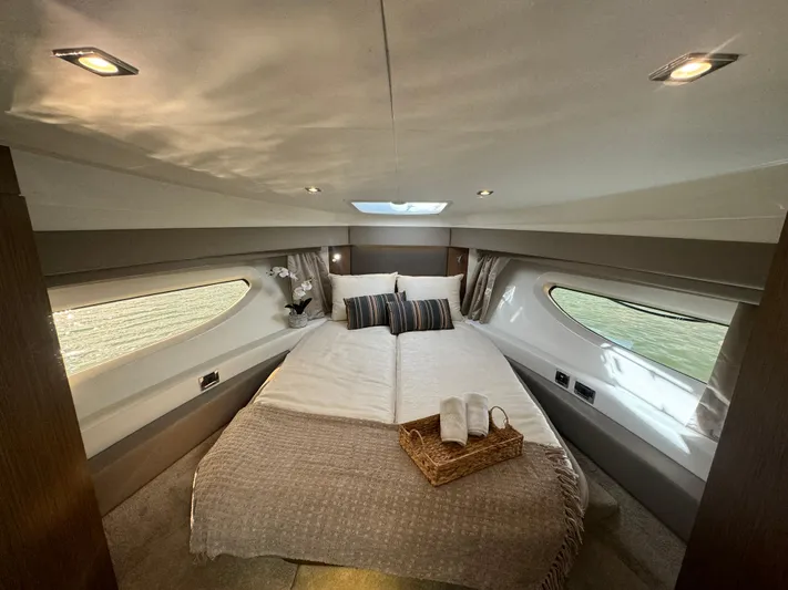  Yacht Photos Pics Luxurious 2017 Sea Ray Sundancer cabin interior with cozy bed and elegant decor.