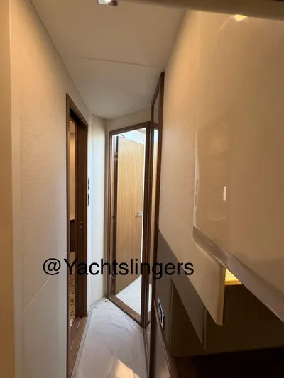  Yacht Photos Pics Narrow hallway inside 2017 Sea Ray Sundancer yacht with wooden doors and modern design.