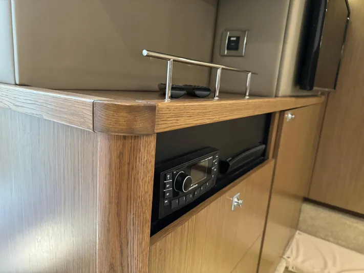  Yacht Photos Pics 2017 Sea Ray Sundancer interior with wooden cabinetry and built-in stereo system.