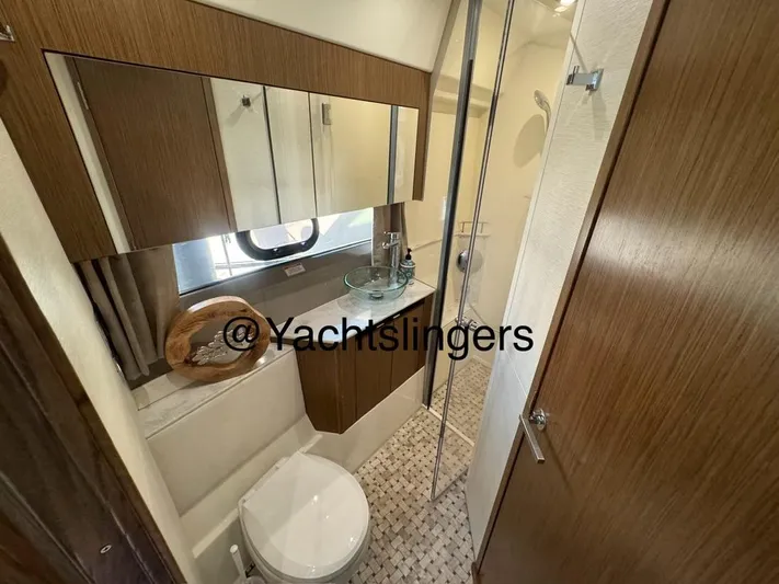  Yacht Photos Pics 2017 Sea Ray Sundancer yacht bathroom with modern fixtures and wood accents.