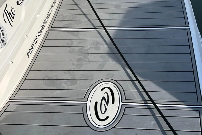 Y Knot Yacht Photos Pics 2021 Regal 36 Grande Coupe boat deck with custom logo and port name.