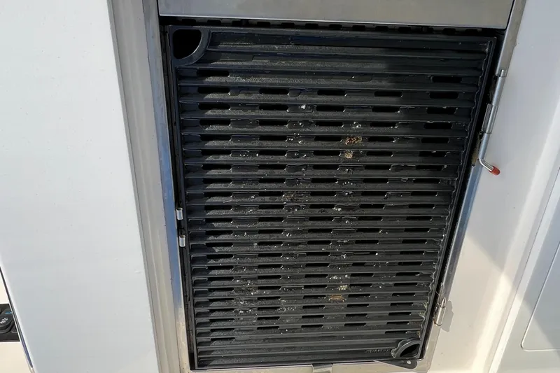 Y Knot Yacht Photos Pics Grill on 2021 Regal 36 Grande Coupe boat, featuring sleek design and functionality.