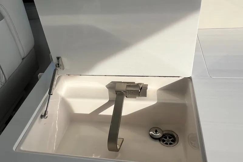 Y Knot Yacht Photos Pics 2021 Regal 36 Grande Coupe yacht sink with modern faucet design.