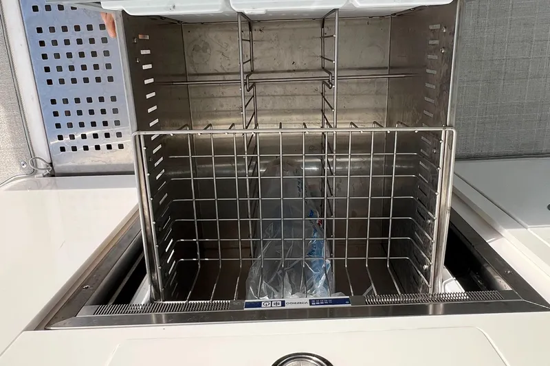 Y Knot Yacht Photos Pics Open storage compartment on 2021 Regal 36 Grande Coupe boat.