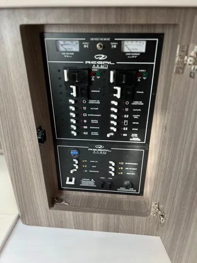Y Knot Yacht Photos Pics Electrical control panel of a 2021 Regal 36 Grande Coupe boat.