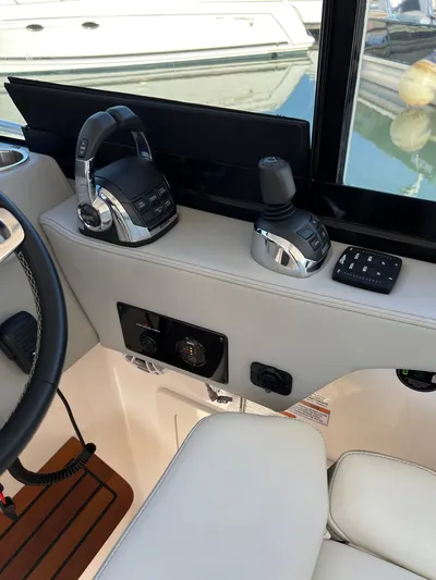 Y Knot Yacht Photos Pics 2021 Regal 36 Grande Coupe helm controls with joystick and throttle.