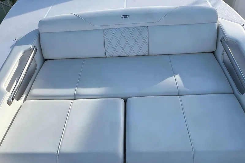 Y Knot Yacht Photos Pics 2021 Regal 36 Grande Coupe white leather seating, elegant design, luxury yacht interior.