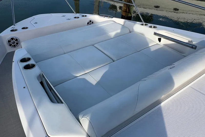 Y Knot Yacht Photos Pics 2021 Regal 36 Grande Coupe boat with spacious white sunbed and cup holders.