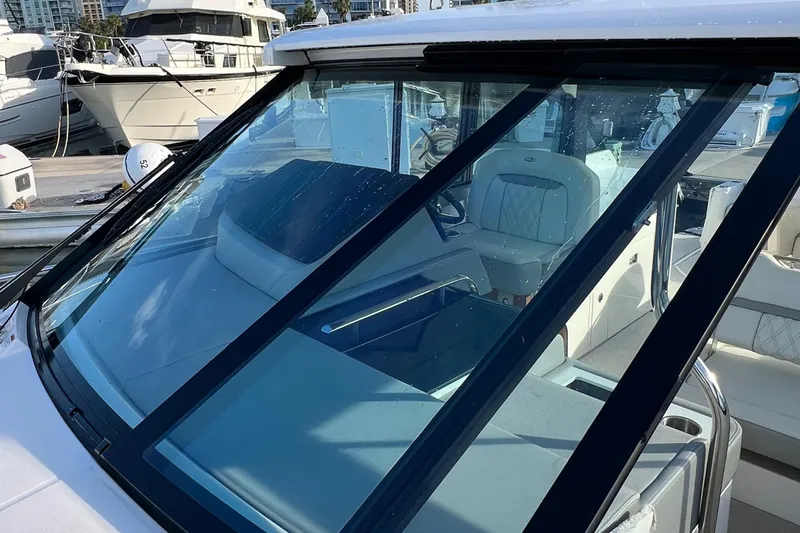 Y Knot Yacht Photos Pics 2021 Regal 36 Grande Coupe yacht with sleek windshield and luxurious interior.