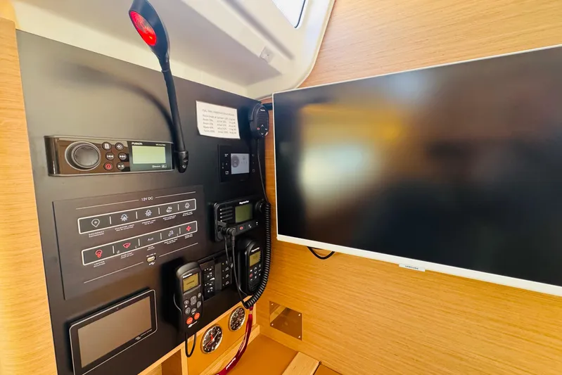 Pearl Yacht Photos Pics Control panel and screen inside 2023 Jeanneau 380 yacht cabin.