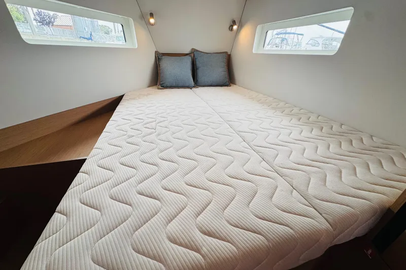 Pearl Yacht Photos Pics 2023 Jeanneau 380 yacht cabin with cozy bed and modern design.