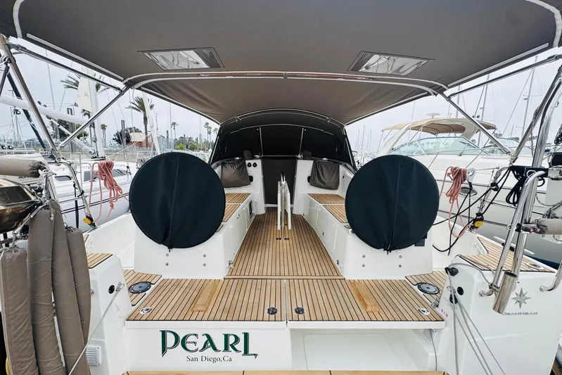 Pearl Yacht Photos Pics 2023 Jeanneau 380 sailboat with covered cockpit, docked in San Diego marina.