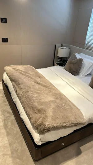 Sunlife Yacht Photos Pics Luxurious bedroom interior on 2024 Azimut Grande 27 METRI yacht, featuring elegant bedding and modern decor.