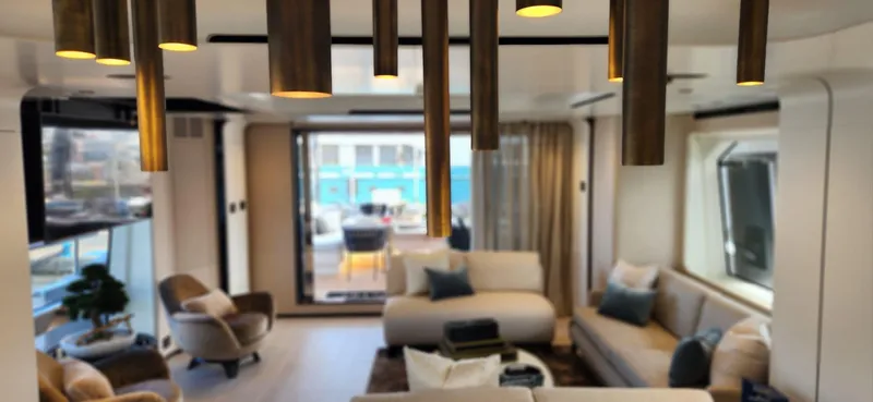 Sunlife Yacht Photos Pics Luxurious interior of 2024 Azimut Grande 27 METRI yacht with modern furnishings and elegant lighting.