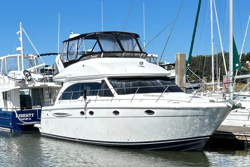 Miss Louise II Yacht Photos Pics 2007 Meridian 411SB yacht docked in marina under clear blue sky.