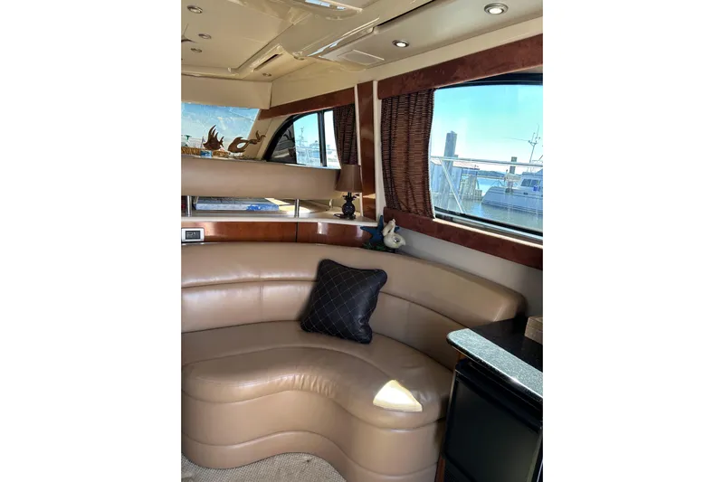 Miss Louise II Yacht Photos Pics Luxurious interior of 2007 Meridian 411SB yacht with leather seating and scenic window view.