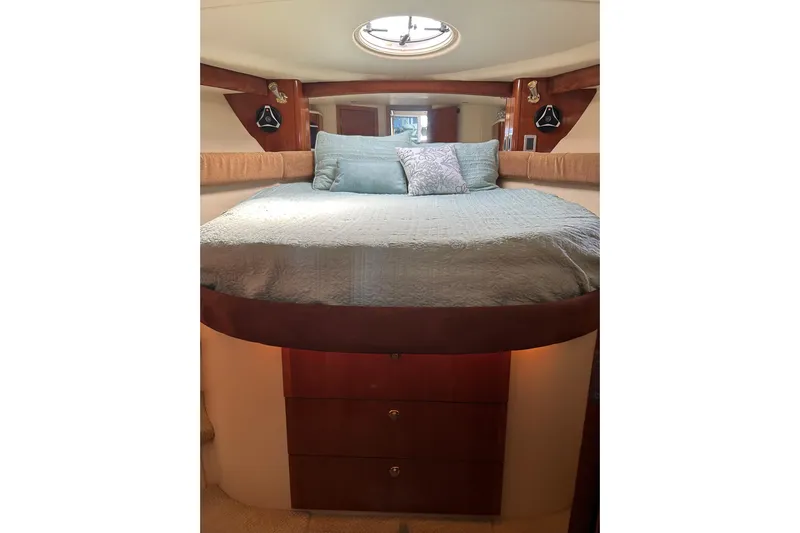 Miss Louise II Yacht Photos Pics Luxurious bedroom interior of 2007 Meridian 411SB yacht with elegant bedding and wood accents.