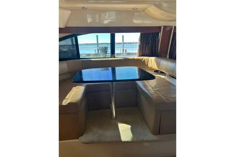 Miss Louise II Yacht Photos Pics Luxurious interior of 2007 Meridian 411SB yacht with leather seating and waterfront view.