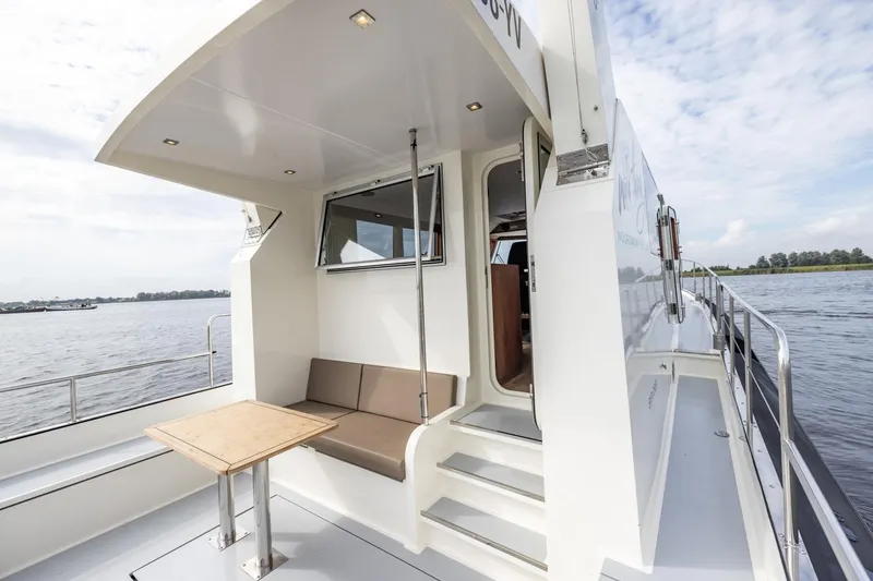 Wild Thing Yacht Photos Pics Explorer NG 50 Alu Fast Going 2016 yacht with outdoor seating and table on deck.