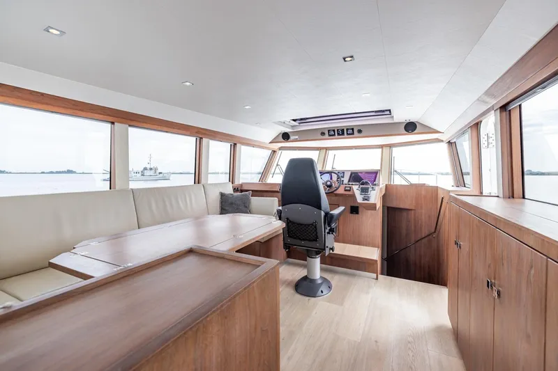 Wild Thing Yacht Photos Pics Interior of 2016 Explorer NG 50 Alu Fast Going yacht with modern helm and seating.
