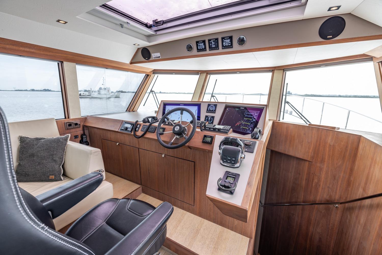 Interior of 2016 Explorer NG 50 Alu Fast Going yacht cockpit with modern navigation equipment.