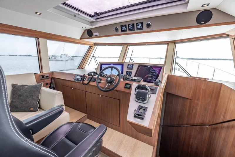Wild Thing Yacht Photos Pics Interior of 2016 Explorer NG 50 Alu Fast Going yacht cockpit with modern navigation equipment.