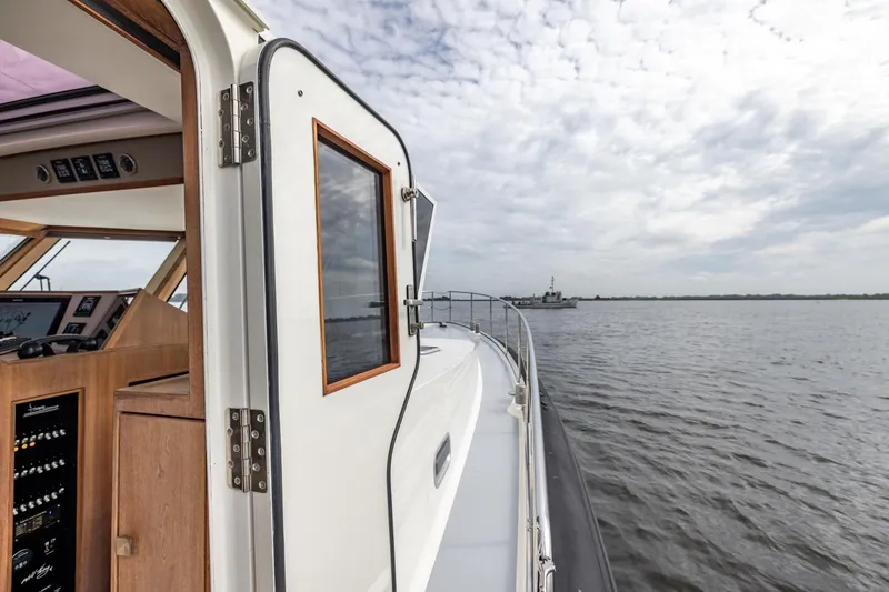 Wild Thing Yacht Photos Pics Explorer NG 50 Alu Fast Going yacht, 2016 model, cruising on open water under cloudy skies.