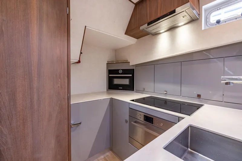 Wild Thing Yacht Photos Pics Modern kitchen in 2016 Explorer NG 50 Alu Fast Going yacht, featuring sleek cabinetry and appliances.