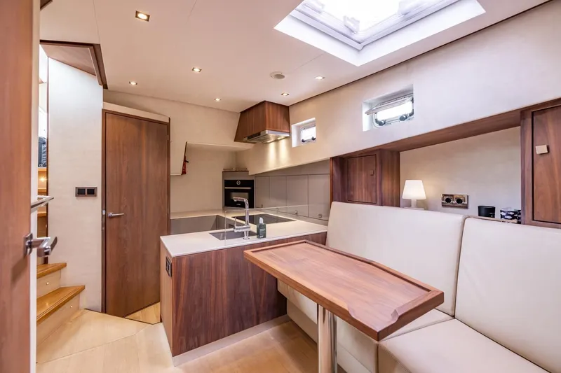 Wild Thing Yacht Photos Pics Luxurious interior of 2016 Explorer NG 50 Alu Fast Going yacht with modern kitchen and seating area.