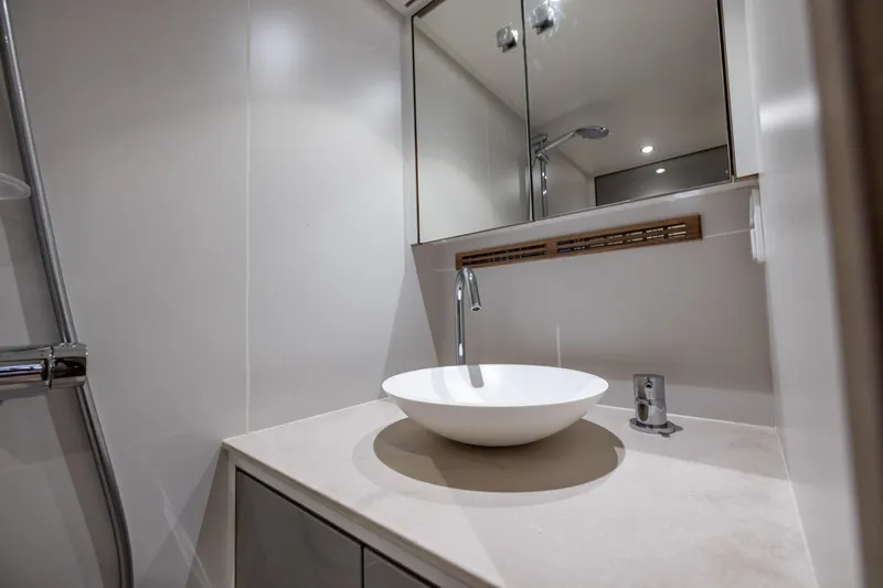 Wild Thing Yacht Photos Pics Modern yacht bathroom with sleek sink and mirror, Explorer NG 50 Alu Fast Going, 2016.